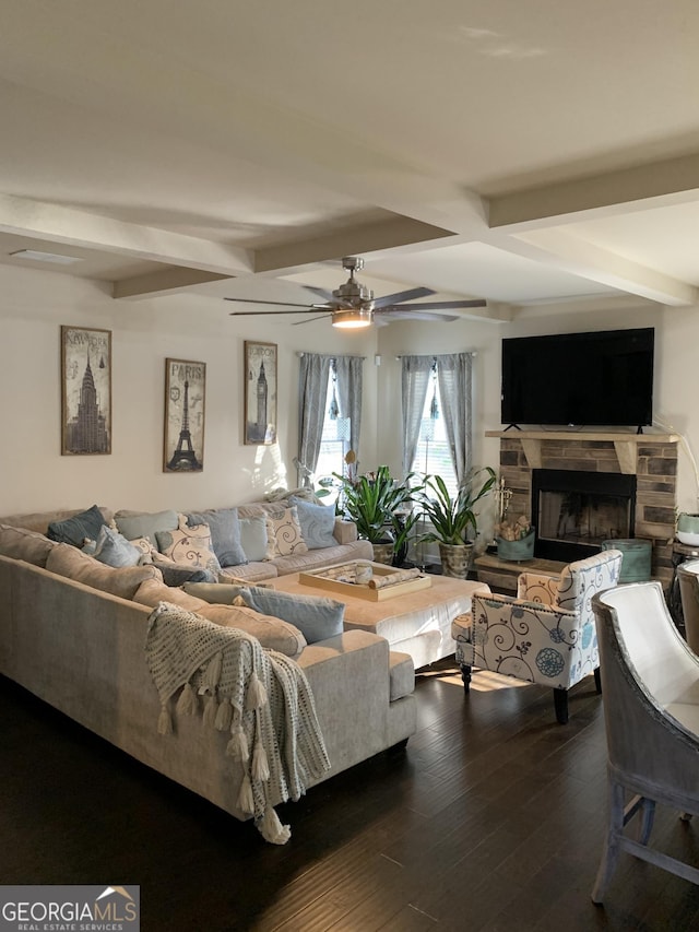 living room featuring a fireplace, beam ceiling, dark hardwood / wood-style floors, and ceiling fan