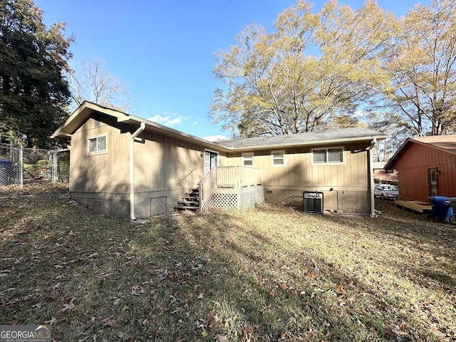 rear view of house with central air condition unit