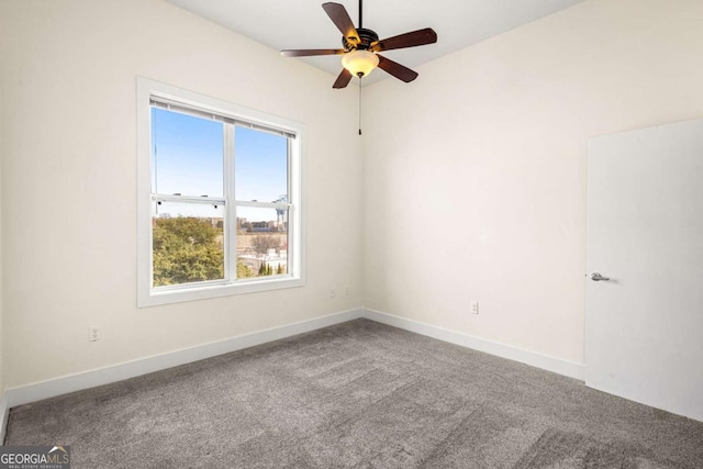 empty room featuring carpet and ceiling fan