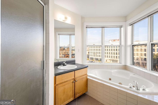 bathroom with vanity, tile patterned floors, and separate shower and tub