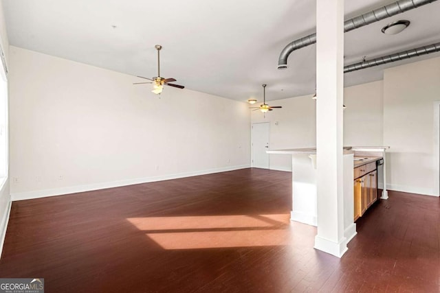 unfurnished living room with dark hardwood / wood-style floors