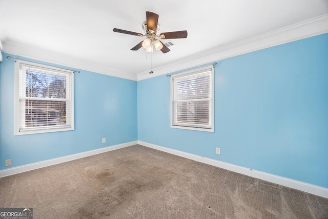 carpeted empty room with ceiling fan and ornamental molding