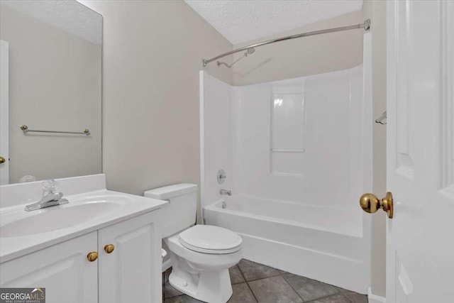 full bathroom with tile patterned flooring, a textured ceiling, toilet, shower / washtub combination, and vanity