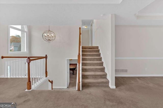 stairs with carpet and a chandelier