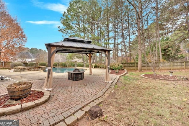 view of yard with a gazebo, a patio, and a fenced in pool