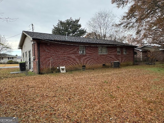 view of side of home featuring central air condition unit