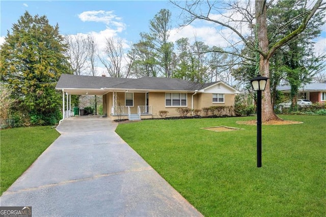 ranch-style home featuring a front yard and a carport