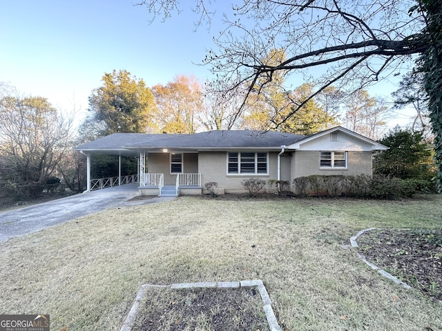 single story home with a carport and a front yard