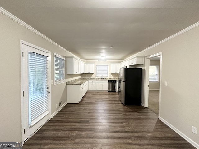 kitchen featuring white cabinets, sink, dark hardwood / wood-style flooring, and stainless steel appliances