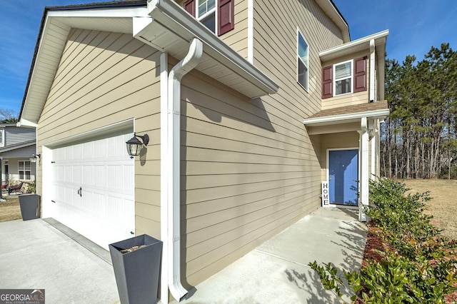 view of side of property featuring a garage