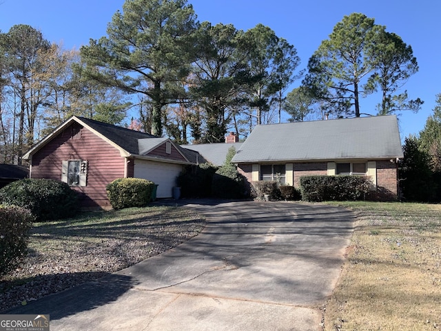 ranch-style house featuring a garage