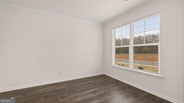 unfurnished room with dark hardwood / wood-style flooring and crown molding