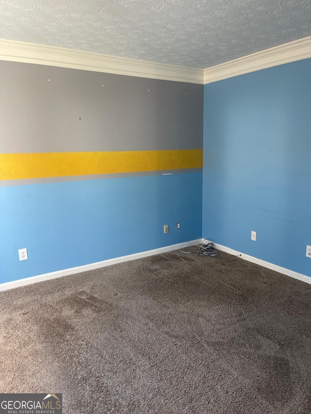 unfurnished room featuring carpet, crown molding, and a textured ceiling