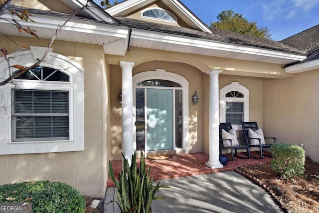 doorway to property featuring covered porch