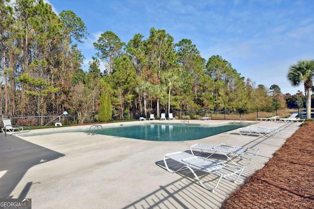 view of pool featuring a patio area