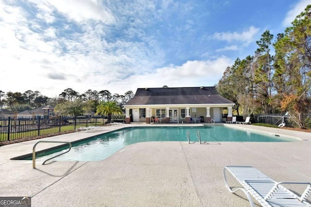 view of swimming pool with a patio