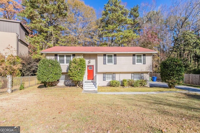 raised ranch featuring a front yard