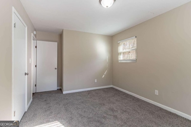 spare room featuring carpet floors