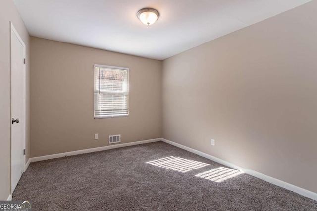 unfurnished room with carpet