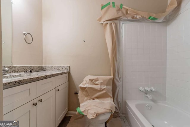 bathroom featuring vanity and tiled shower / bath combo