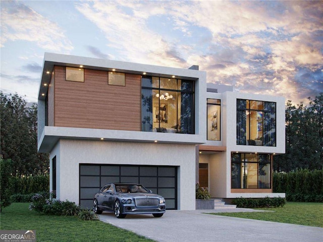 contemporary home featuring a yard and a garage