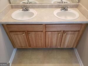 bathroom featuring tile patterned floors and vanity