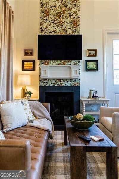 living room featuring a fireplace