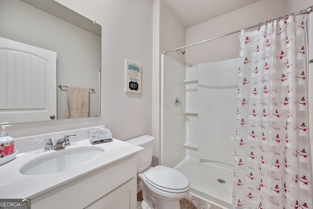 bathroom with a shower with curtain, toilet, and vanity