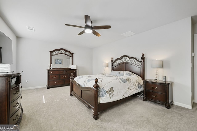 bedroom with light carpet and ceiling fan