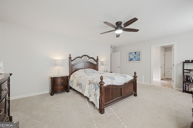 bedroom with ceiling fan and light colored carpet