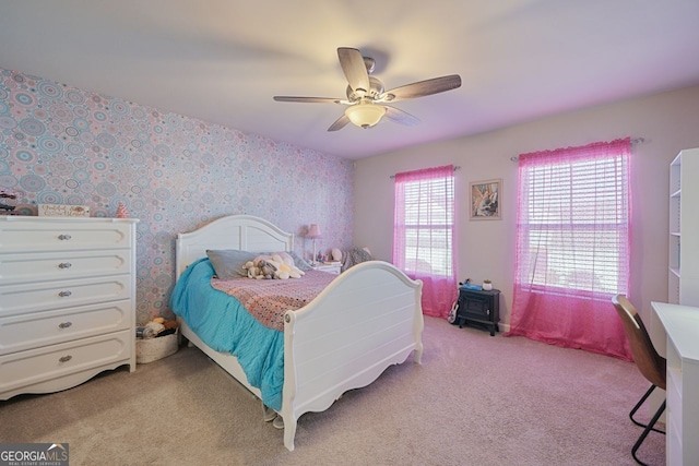 carpeted bedroom with ceiling fan