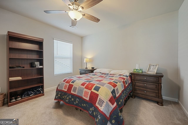 carpeted bedroom with ceiling fan