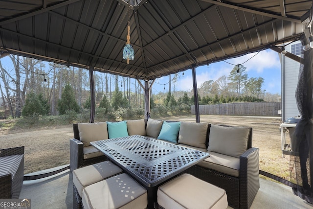 view of patio / terrace with a gazebo, a grill, and an outdoor living space