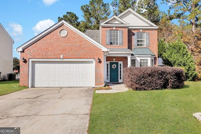 front of property featuring a front lawn, a garage, and central AC