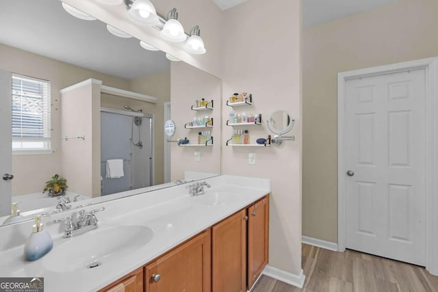 bathroom with hardwood / wood-style floors, vanity, and independent shower and bath