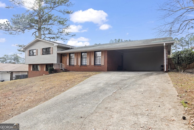 split level home featuring a carport