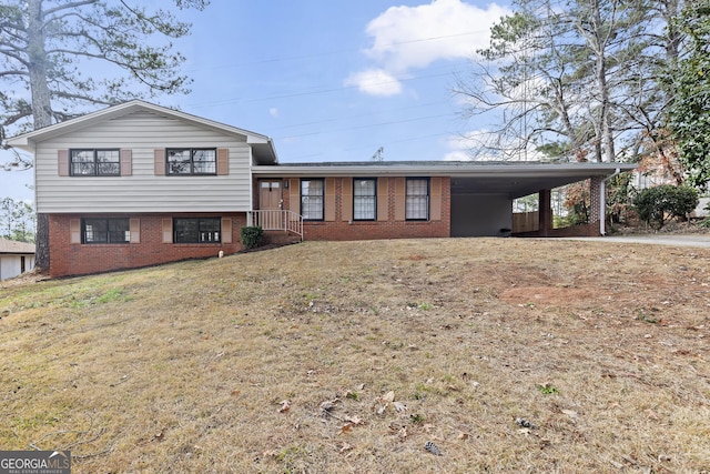 tri-level home featuring a front yard and a carport