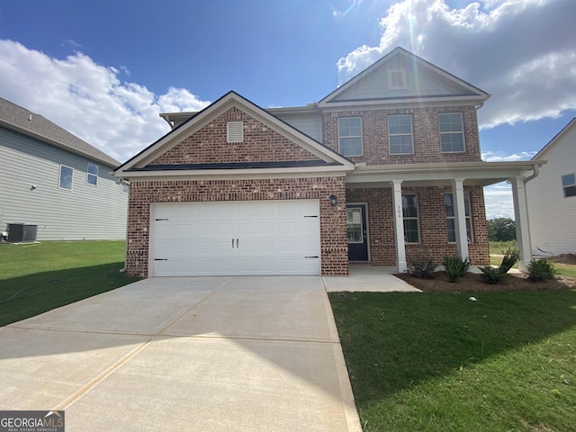 view of front of property with a front lawn, central AC unit, and a garage