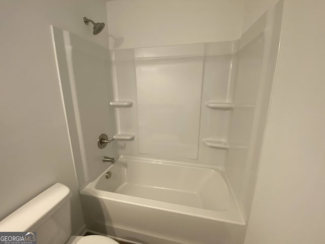 bathroom featuring toilet and shower / washtub combination