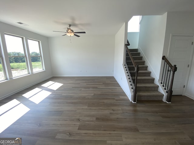 interior space with ceiling fan and dark wood-type flooring