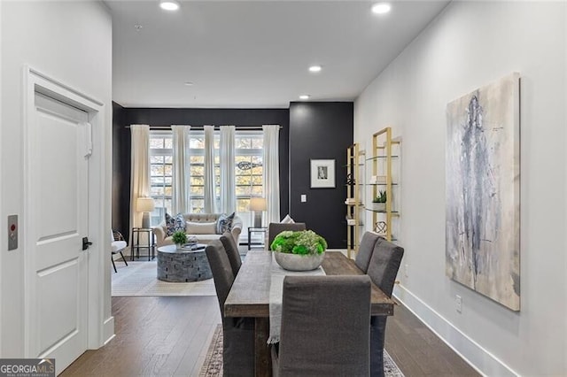 dining room with dark wood-type flooring