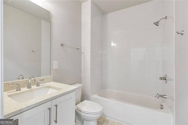 full bathroom with vanity, toilet, and tiled shower / bath