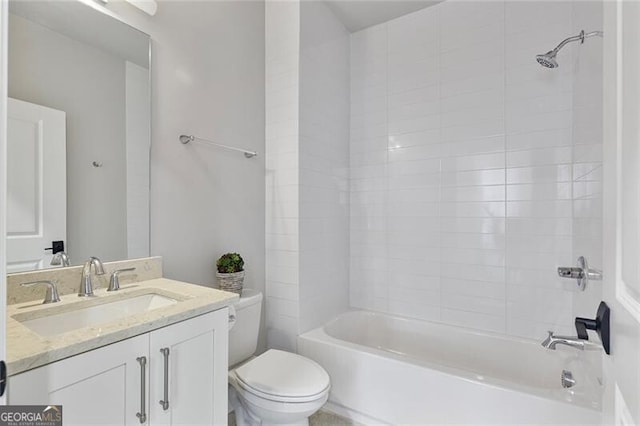 full bathroom with vanity, toilet, and tiled shower / bath