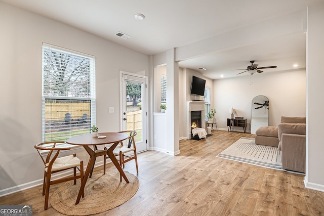 dining room featuring light hardwood / wood-style flooring and ceiling fan