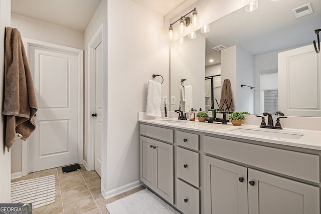 bathroom featuring tile patterned floors and vanity