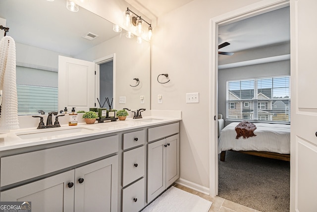 bathroom with ceiling fan and vanity