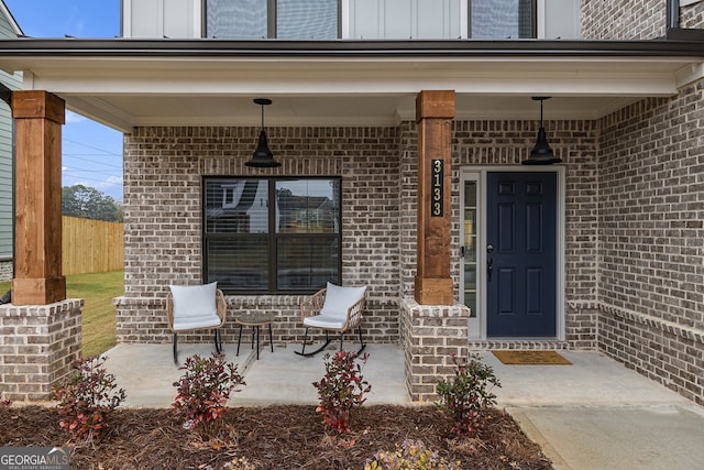 property entrance featuring a porch