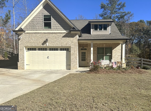 view of front of house with a porch and a garage