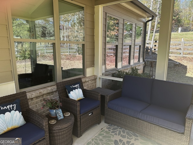 sunroom / solarium with plenty of natural light and lofted ceiling