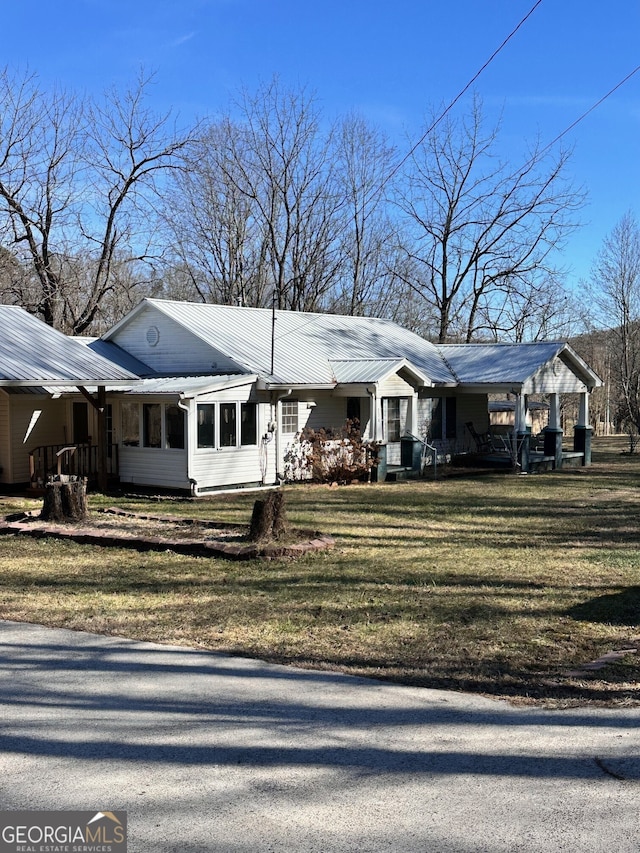 ranch-style home with a front yard and a carport